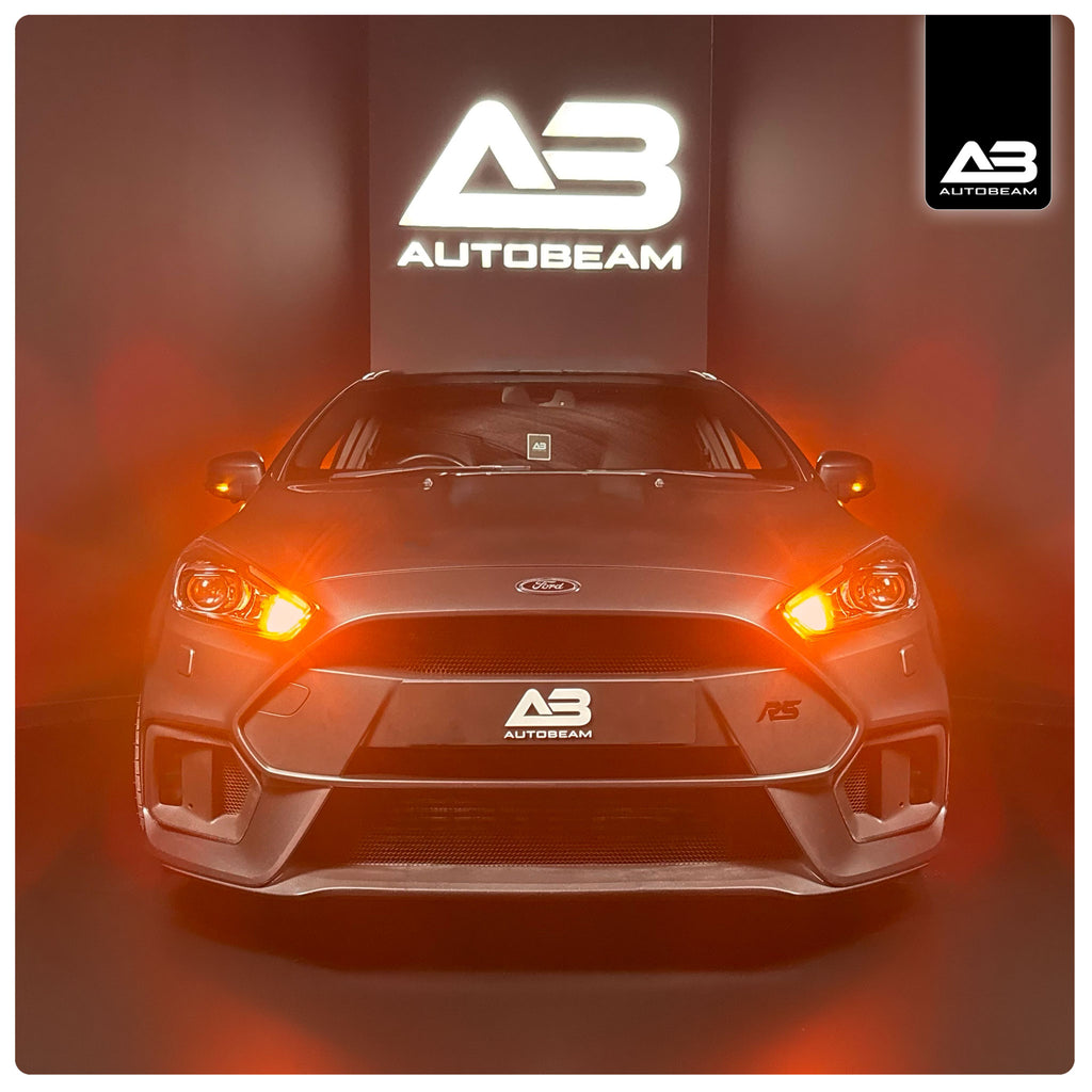 Car with Autobeam headlights on a dark background