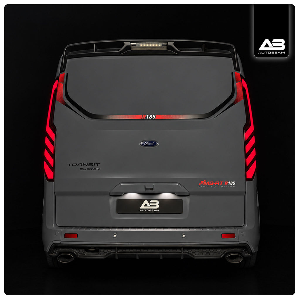 Rear view of a dark grEy Ford Transit Custom van with custom red and black LED taillights.